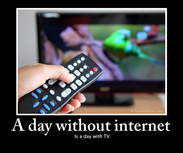 Hand pointing a tv remote control towards the tele