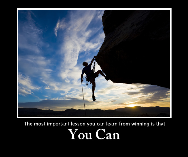 Rock climber dangling.
