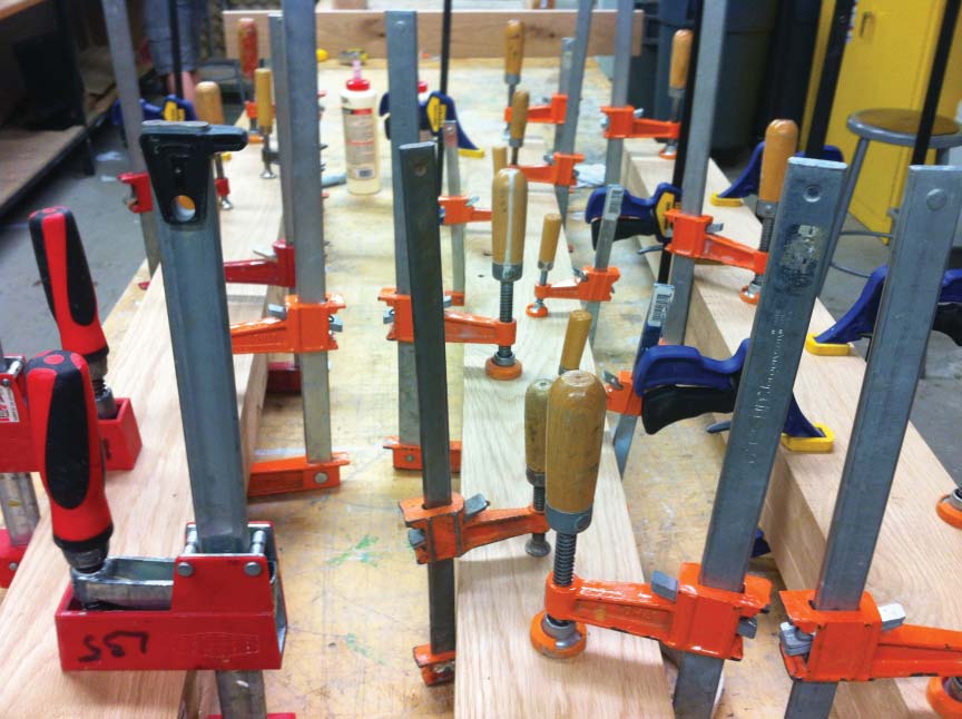 The laminated block of wood was then carefully clamped to a sturdy work surface, in order to ensure successful binding and prevent bowing in any single sheet of wood. The process of drying took about 48 hours.