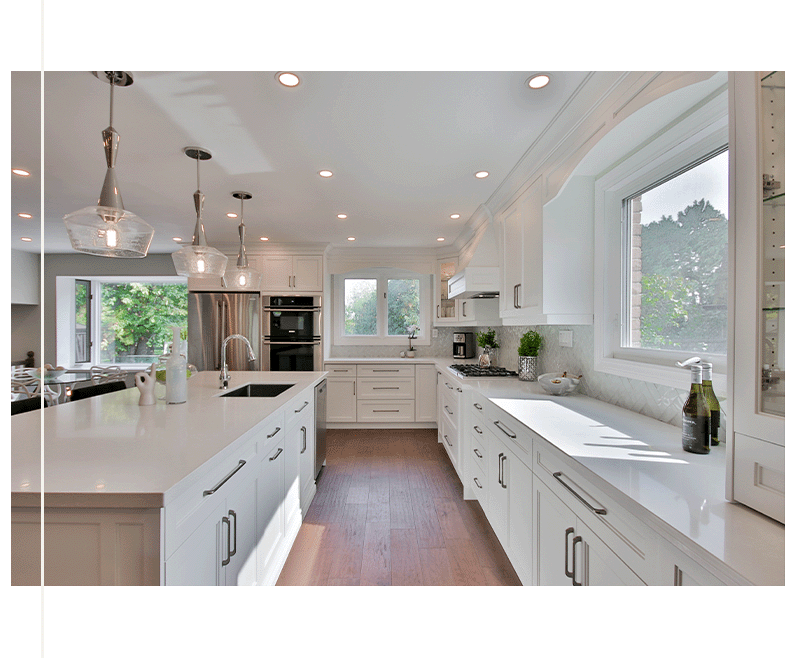 Spacious kitchen with ample counter space, modern appliances, and cabinetry, featuring a bright and inviting atmosphere