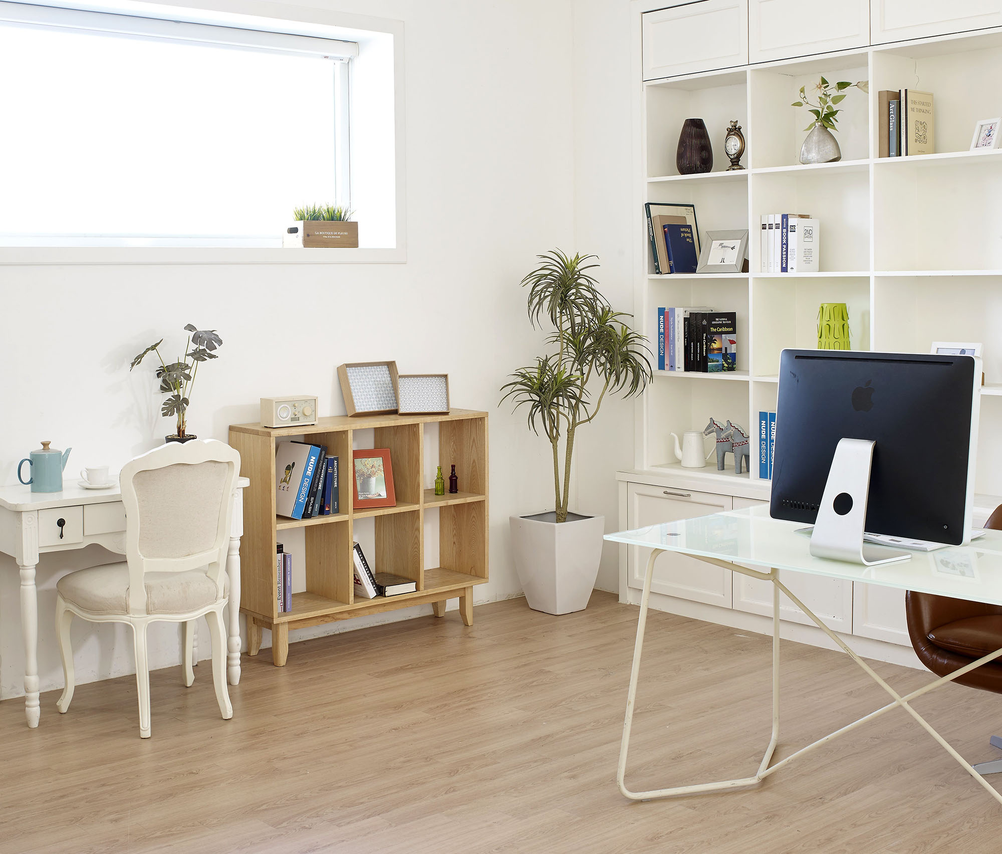 Well-organized home office with a sleek desk, ergonomic chair, and shelves filled with books and office supplies, creating a productive and comfortable workspace