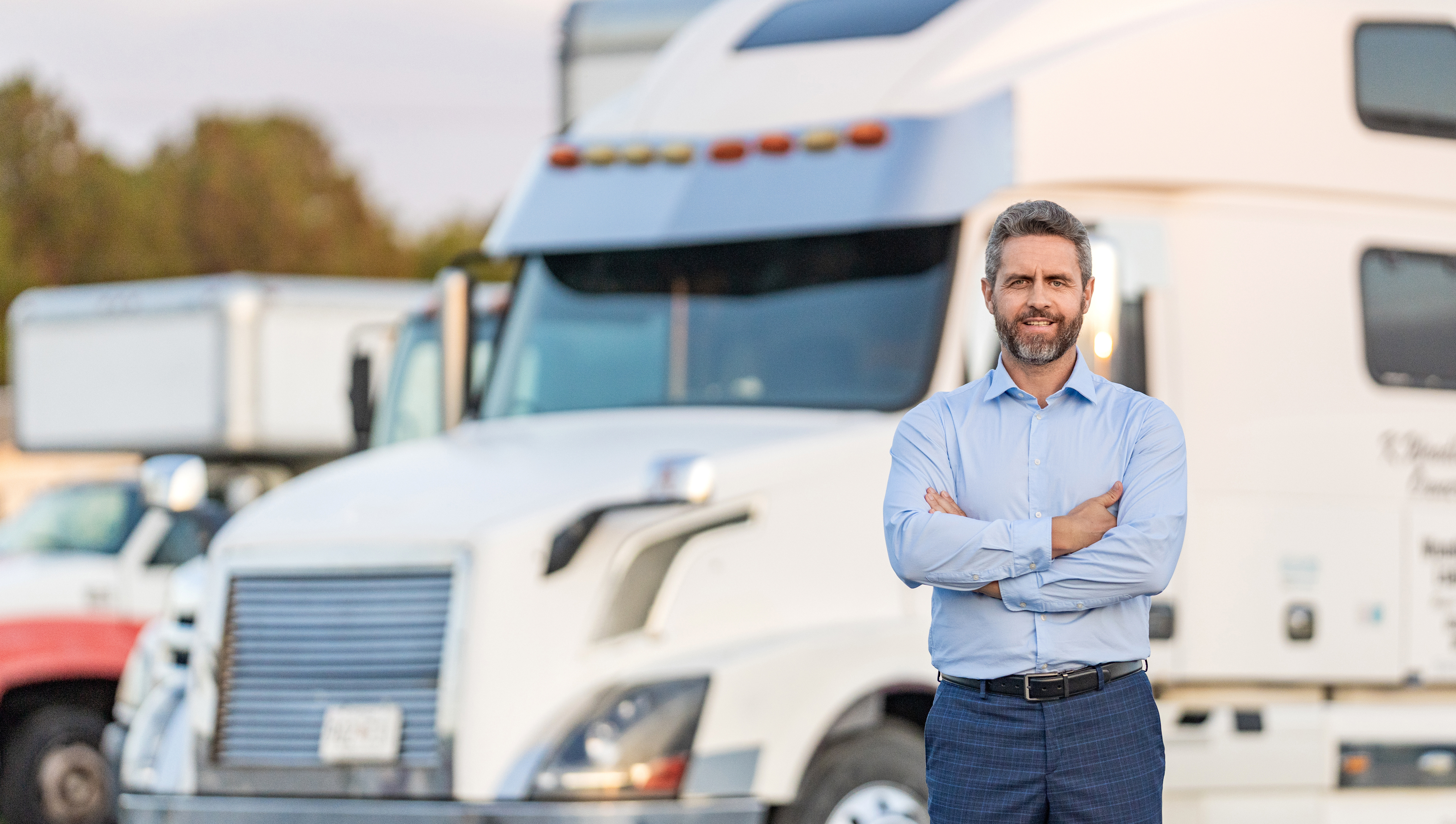 Businessman truck owner banner. Hispanic driver in front of truck. Trucking owner. Truck driver. Man trucker driver near lorry truck. Transportation vehicle. Semi trucks vehicle. Hispanic man trucker.