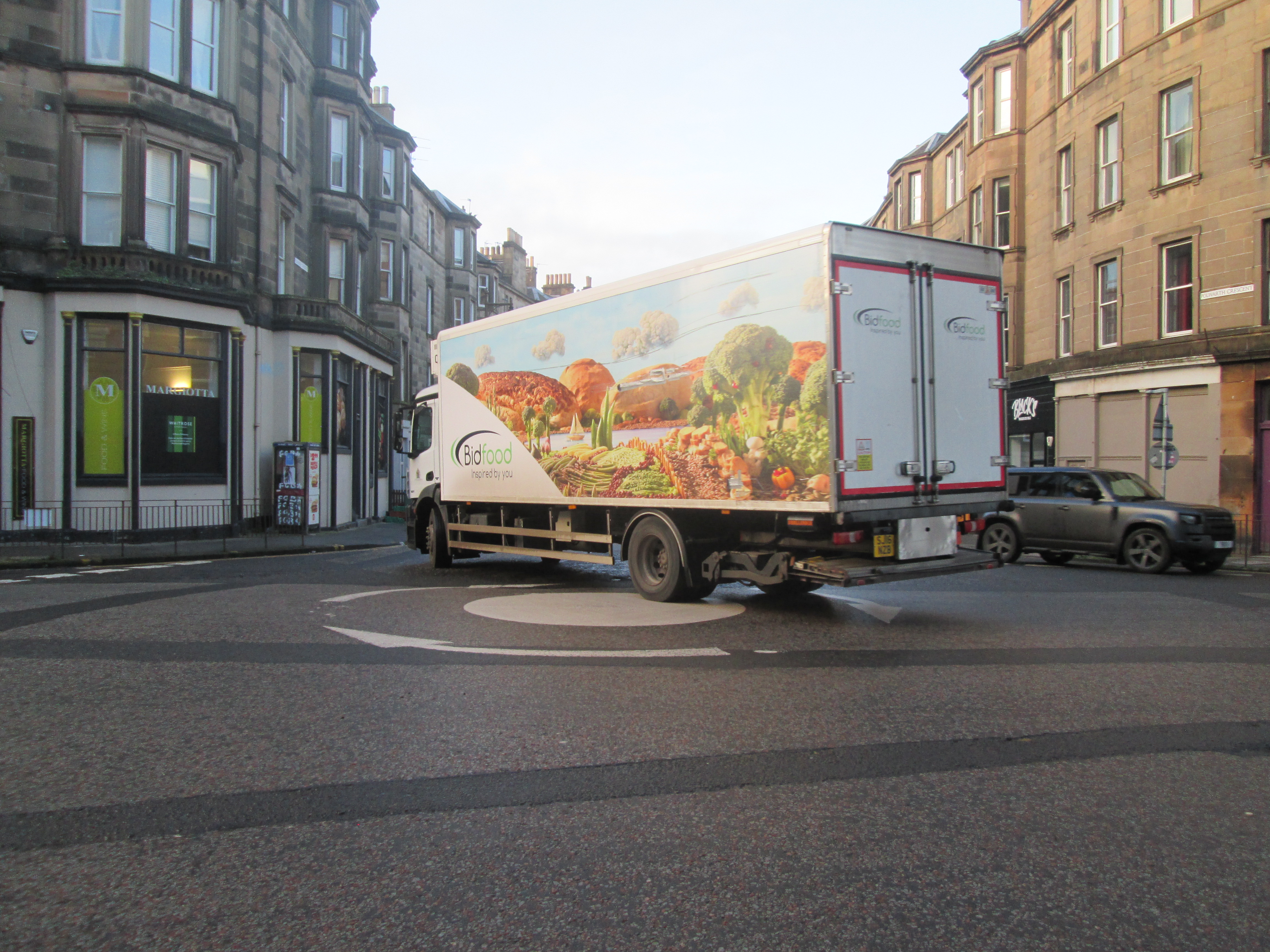 Lorry crossing the centre of Polwarth roundabout