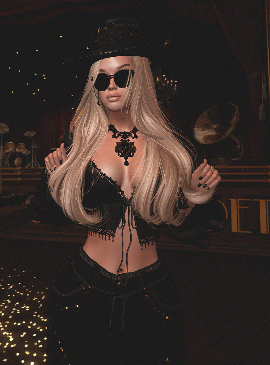 Guest in a black hat and sunglasses posed inside the cabaret
