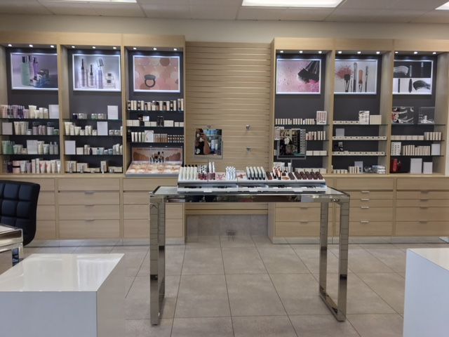 Picture of a makeup franchise showroom with stands and lots of products