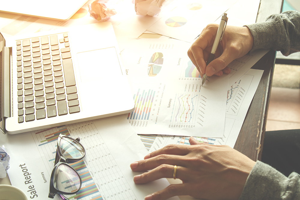 Businessman signature at document. Selective focus and soft flare filter.