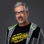 a smiling gentleman with killer hair