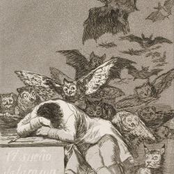 A monochrome etching. A man is at a desk, leaning his head on his arms and facing down. Around him fly owls, bats and other creatures of the night.