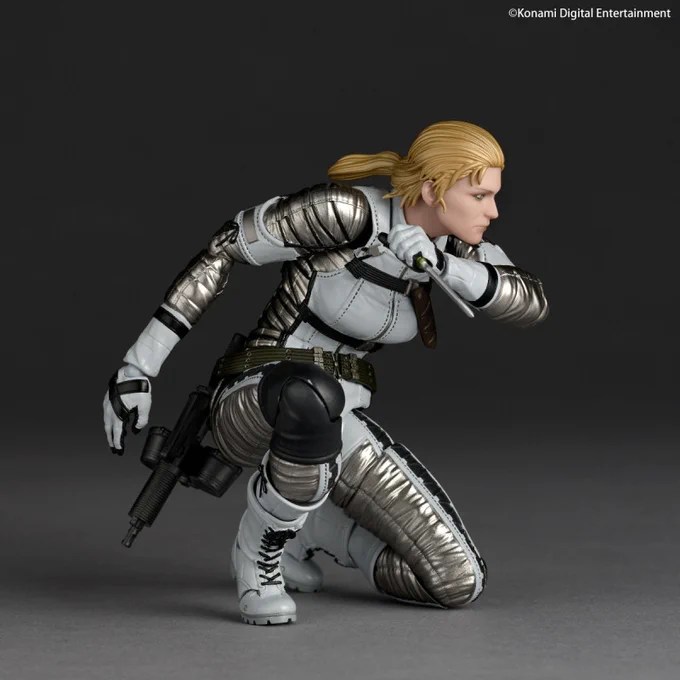 The Boss posed kneeling with her knife and rifle