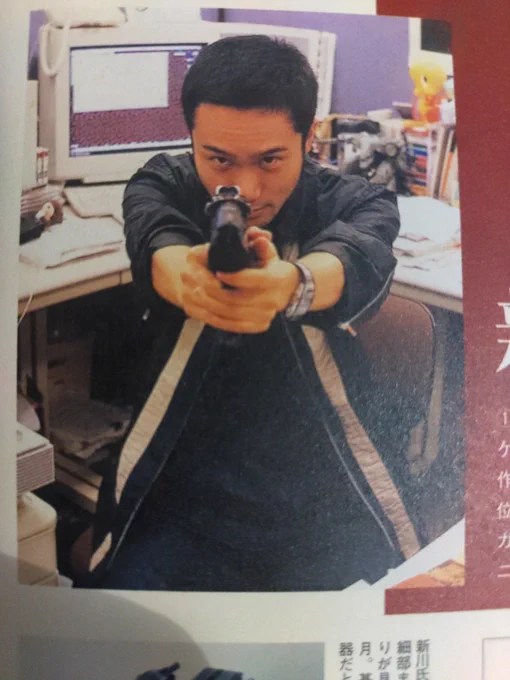 Yoji Shinkawa posing in an office.