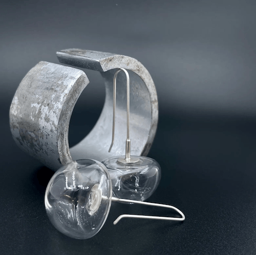 clear upside down glass domes suspended from sterling silver French hooks