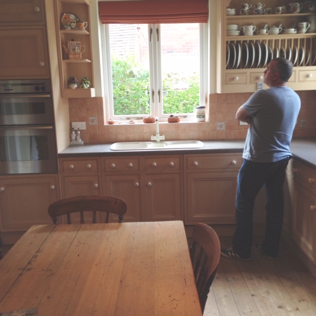 Her husband picking up the kitchen from the previous home 