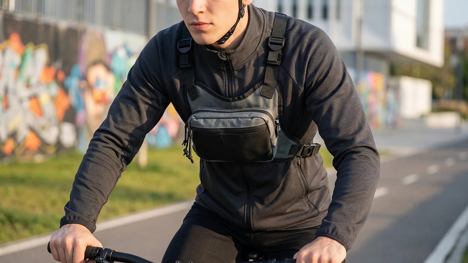 Cyclist wearing gray running chest bag with secure front storage