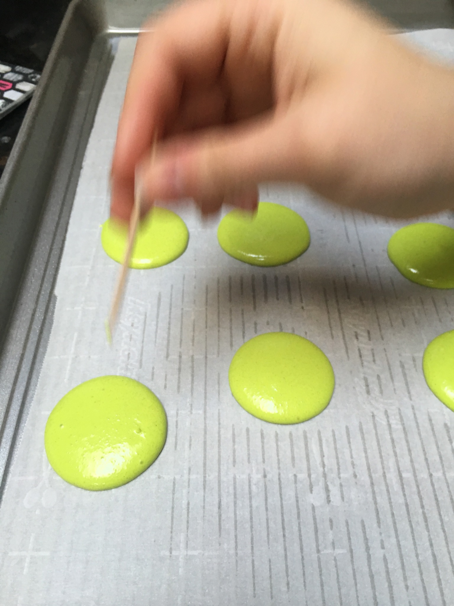 You will see tiny bubbles come to the surface- use a toothpick to pop them