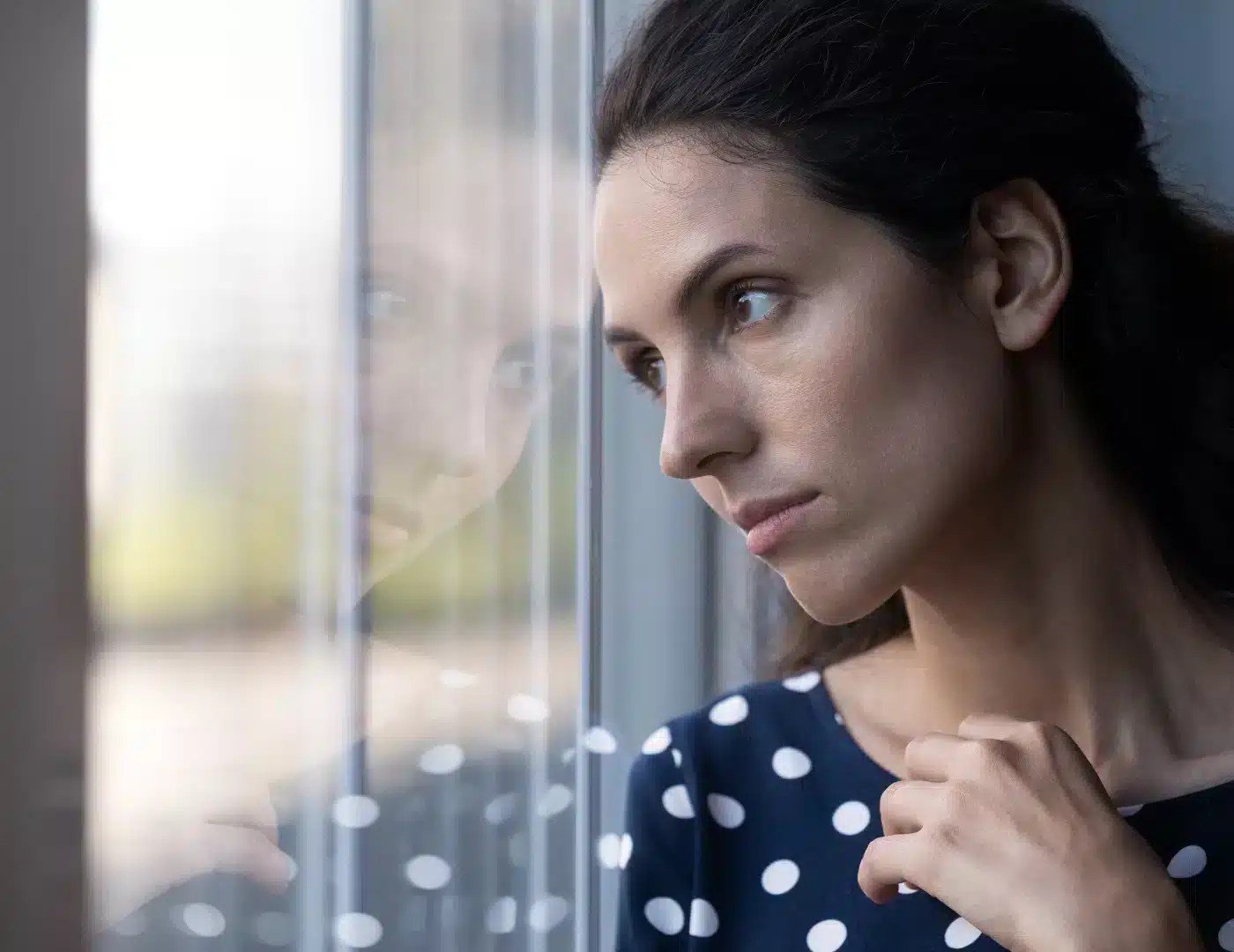 Woman reflecting on managing Type 1 diabetes and tight glucose control.
