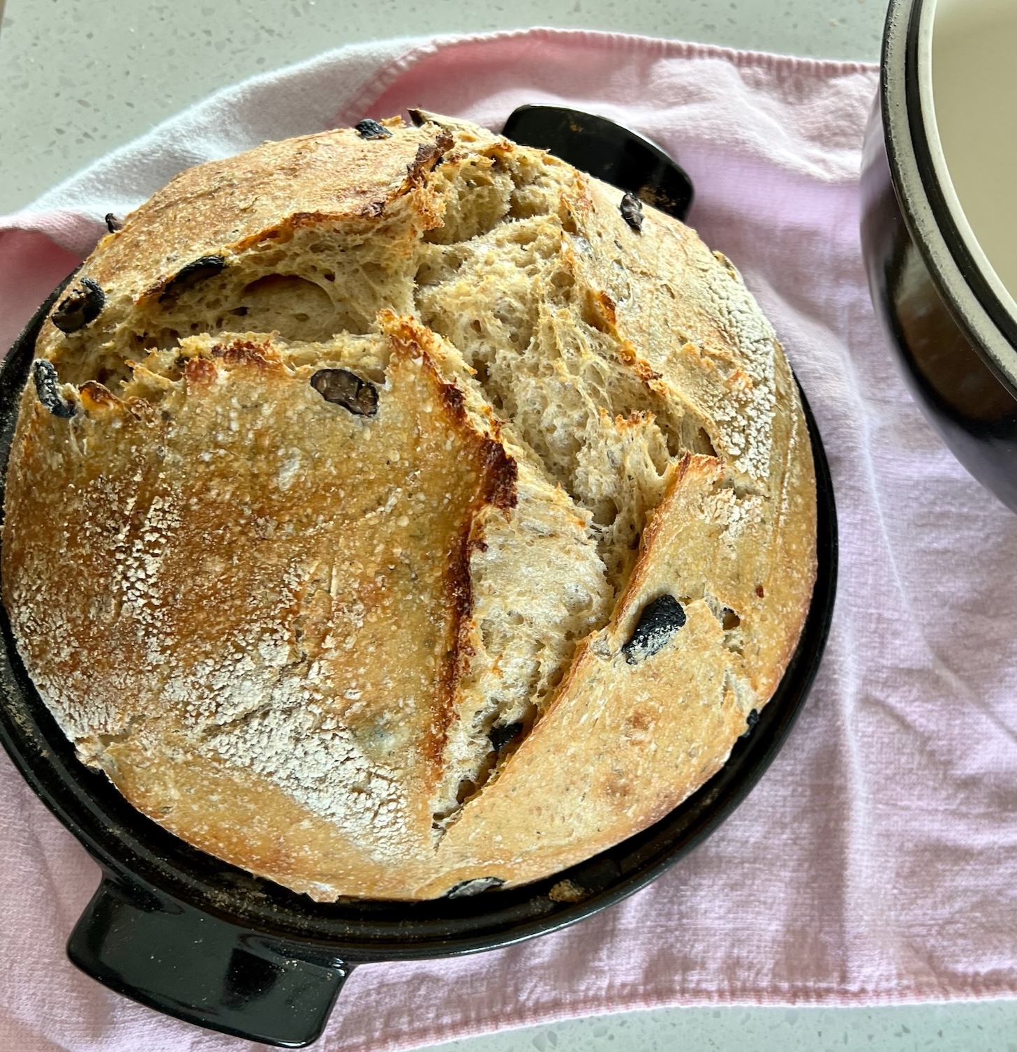 loaf of sourdough bread with olives