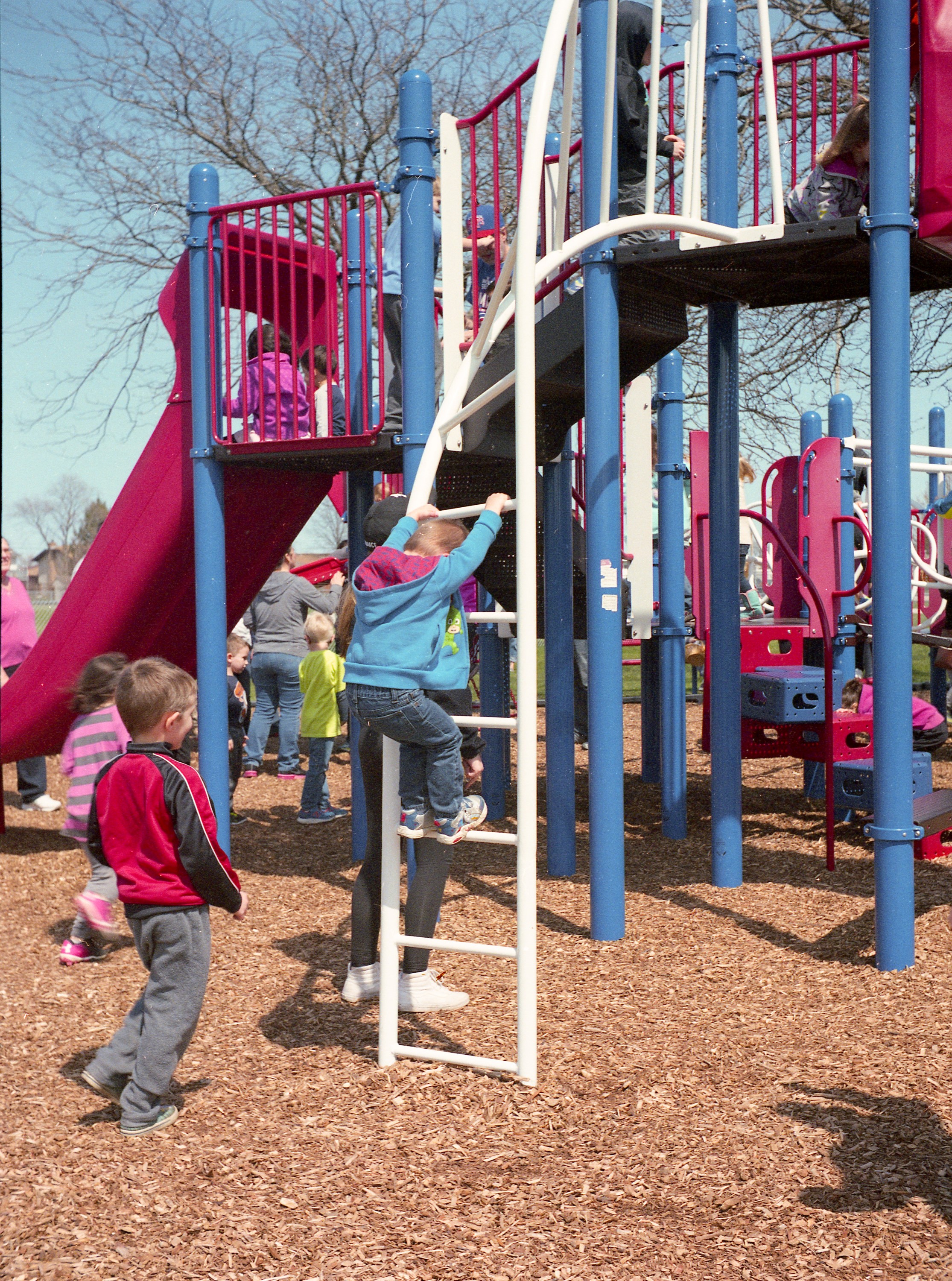 Yet another action shot of children playing on a playground.