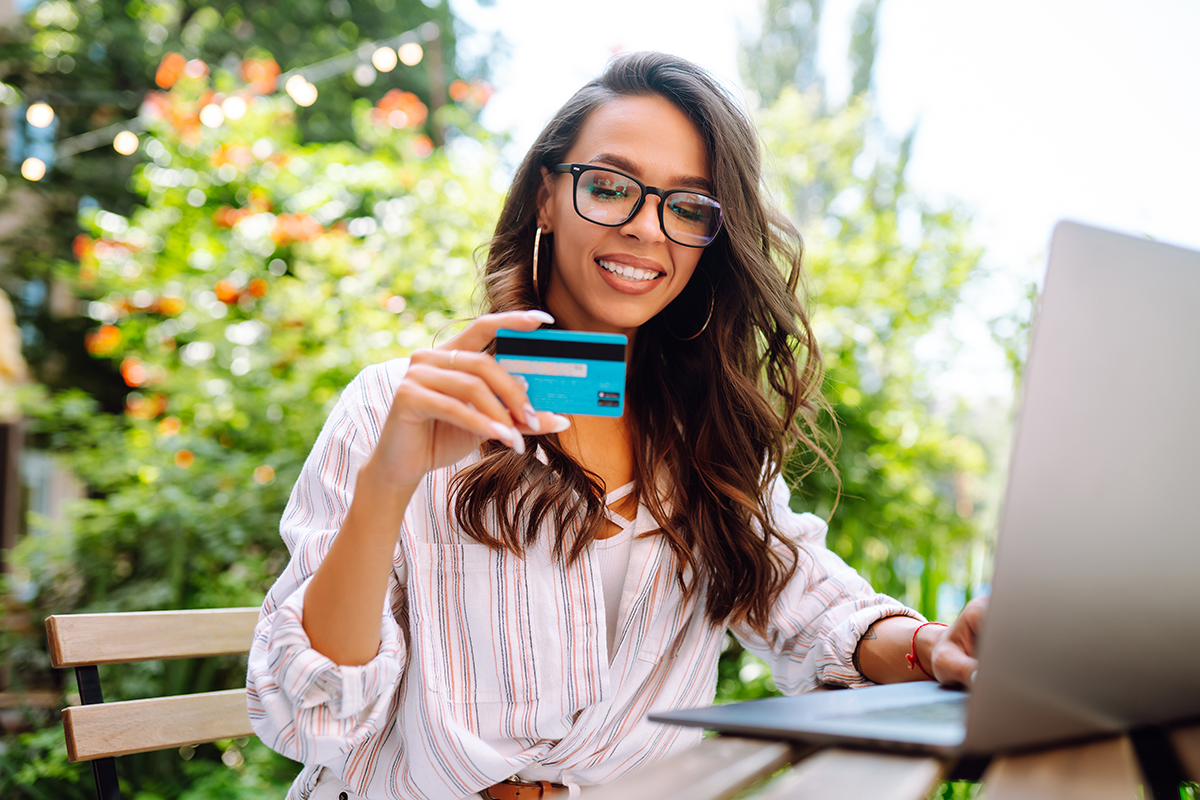 Women consolidating a credit card online