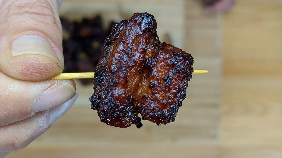 Crispy air fryer pork belly burnt ends coated in sticky hot honey glaze