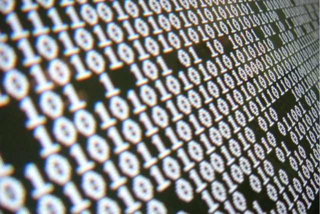 Binary code on computer screen