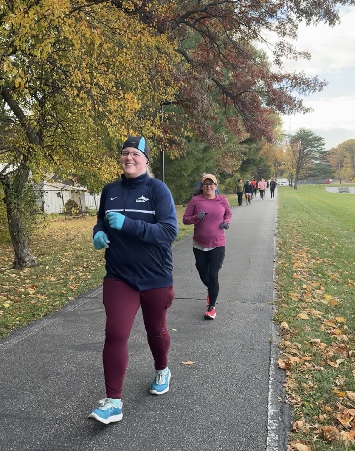 Miles with Misty runners training together on a fall path