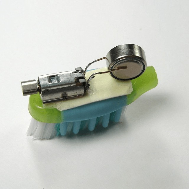 Tiny handmade bot from a toothbrush.