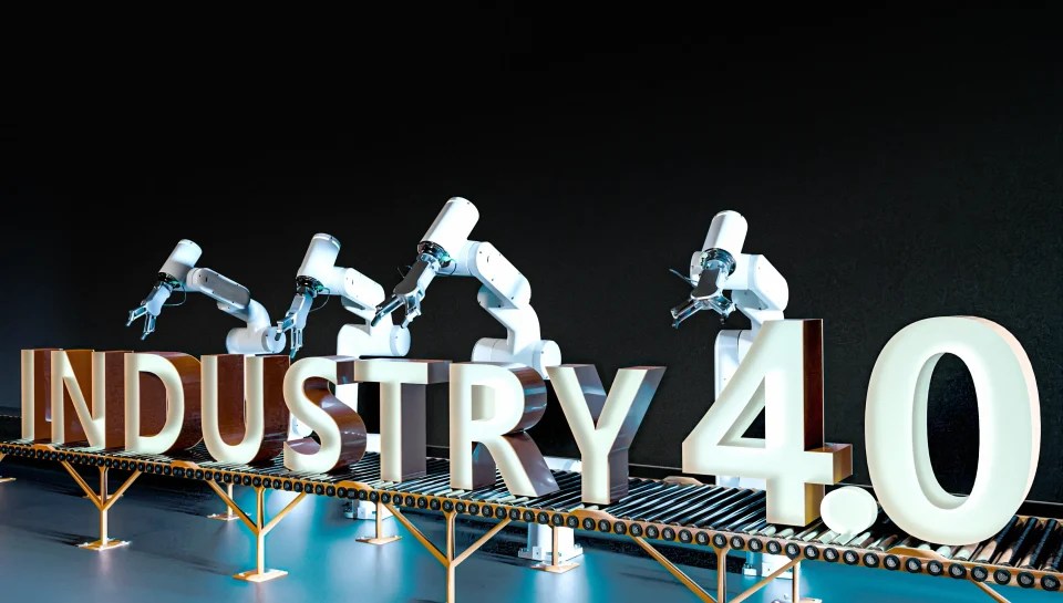 Robotic arms operating on a production line with Industry 4.0 text, representing smart manufacturing and industrial automation.