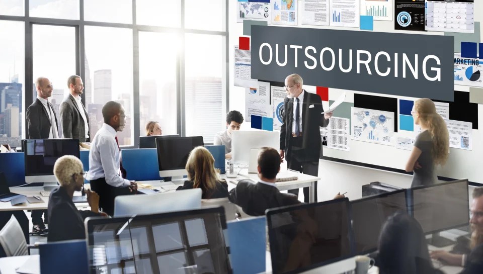Business meeting discussing outsourcing strategy and operations