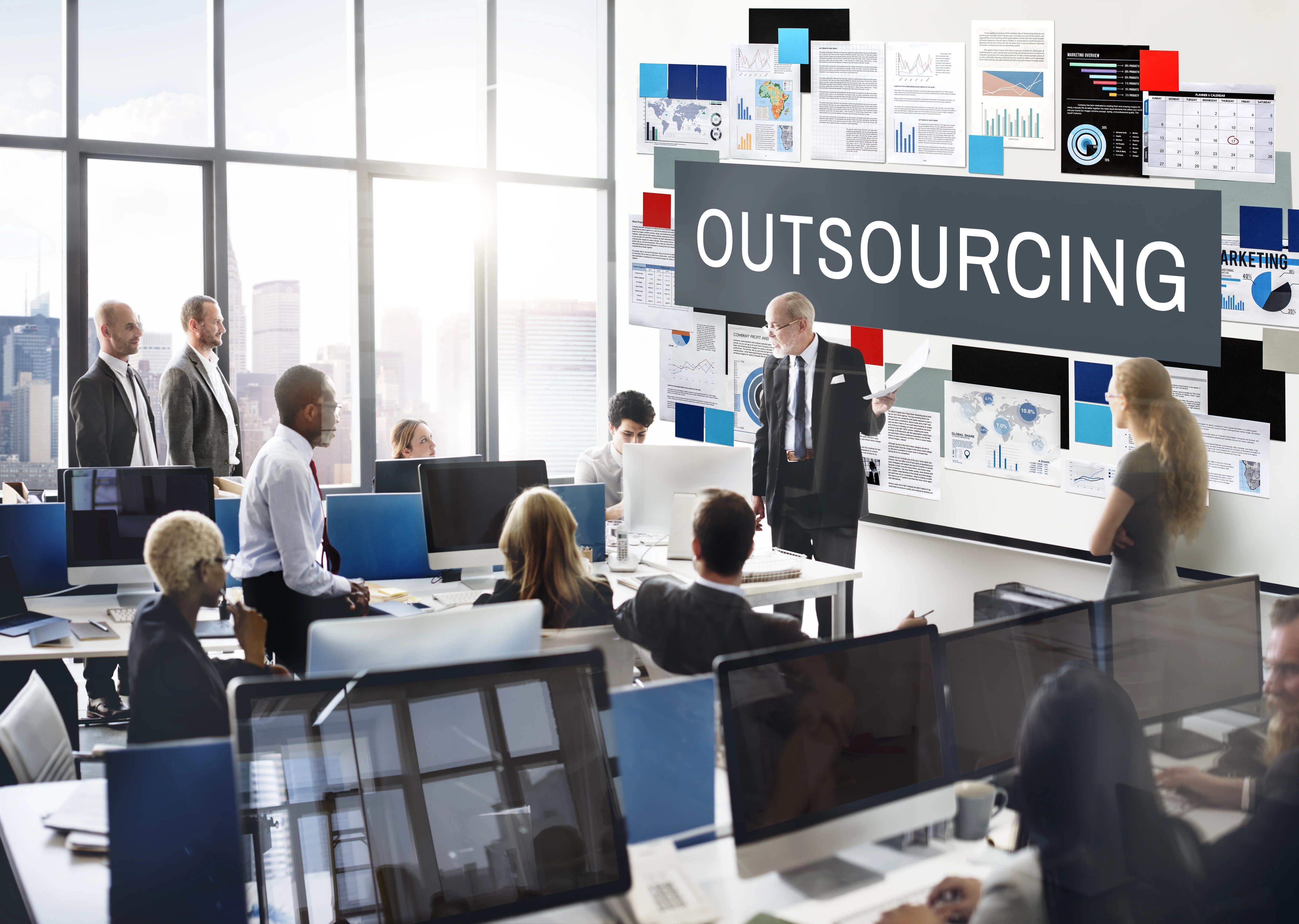 Business meeting discussing outsourcing strategy and operations