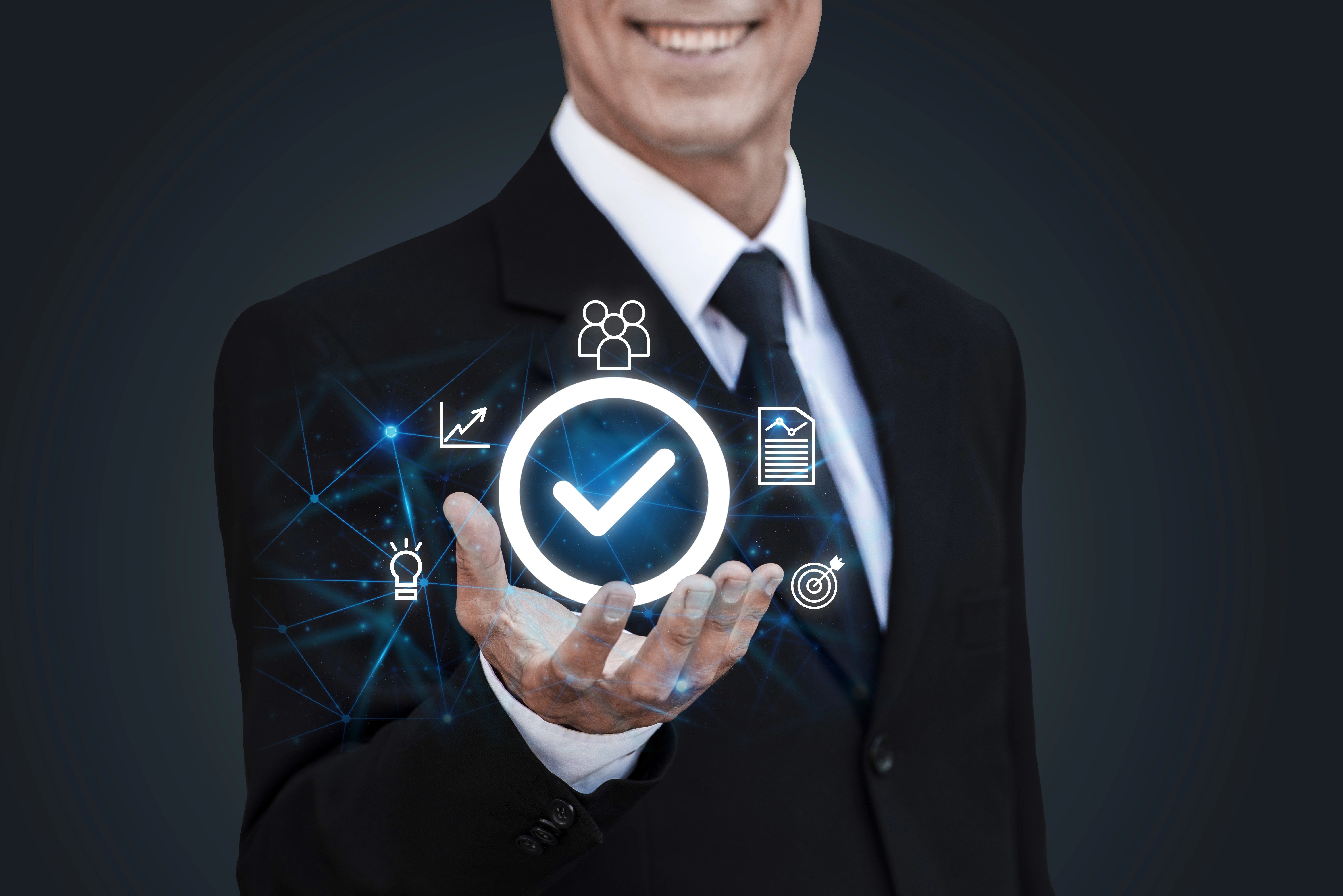 Business professional displaying compliance and quality assurance icons representing governance and performance management