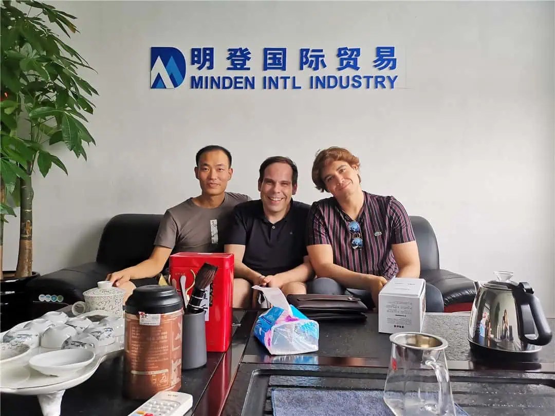 A photo of Minden, a Chinese sourcing agent with a client.