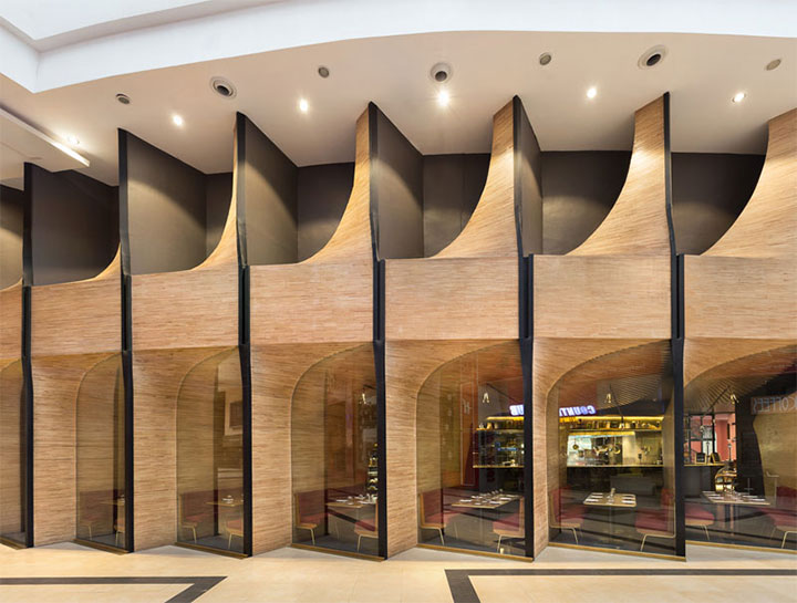 Curved Wood Structures Create A Feeling Of Intimacy In Restaurant Interior Design