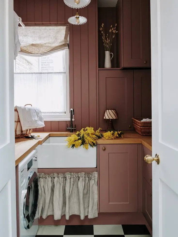 small laundry room hidden laundry sorting