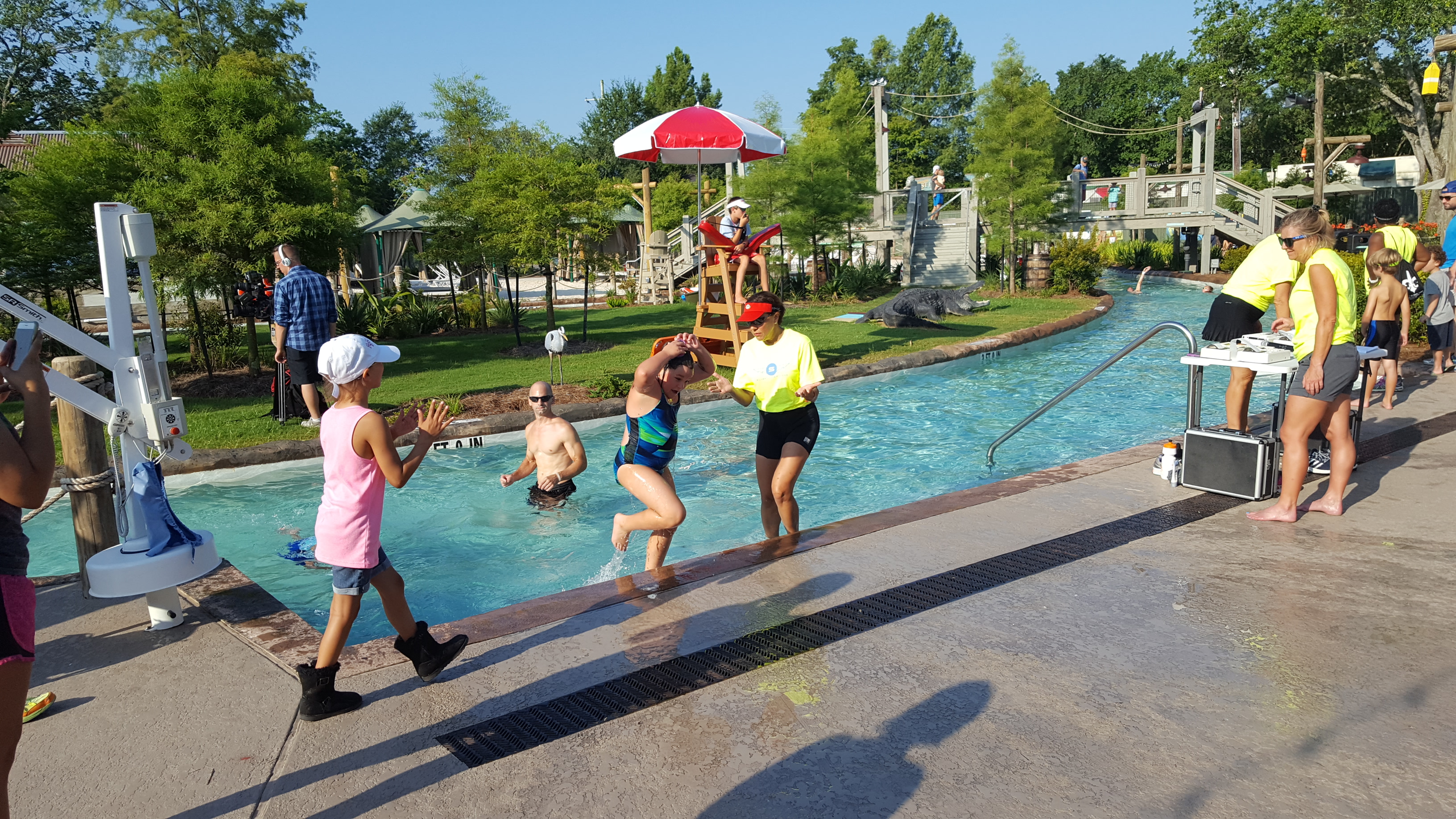 Rosie greeting Lizzie as soon as she gets done crushing the swim.
