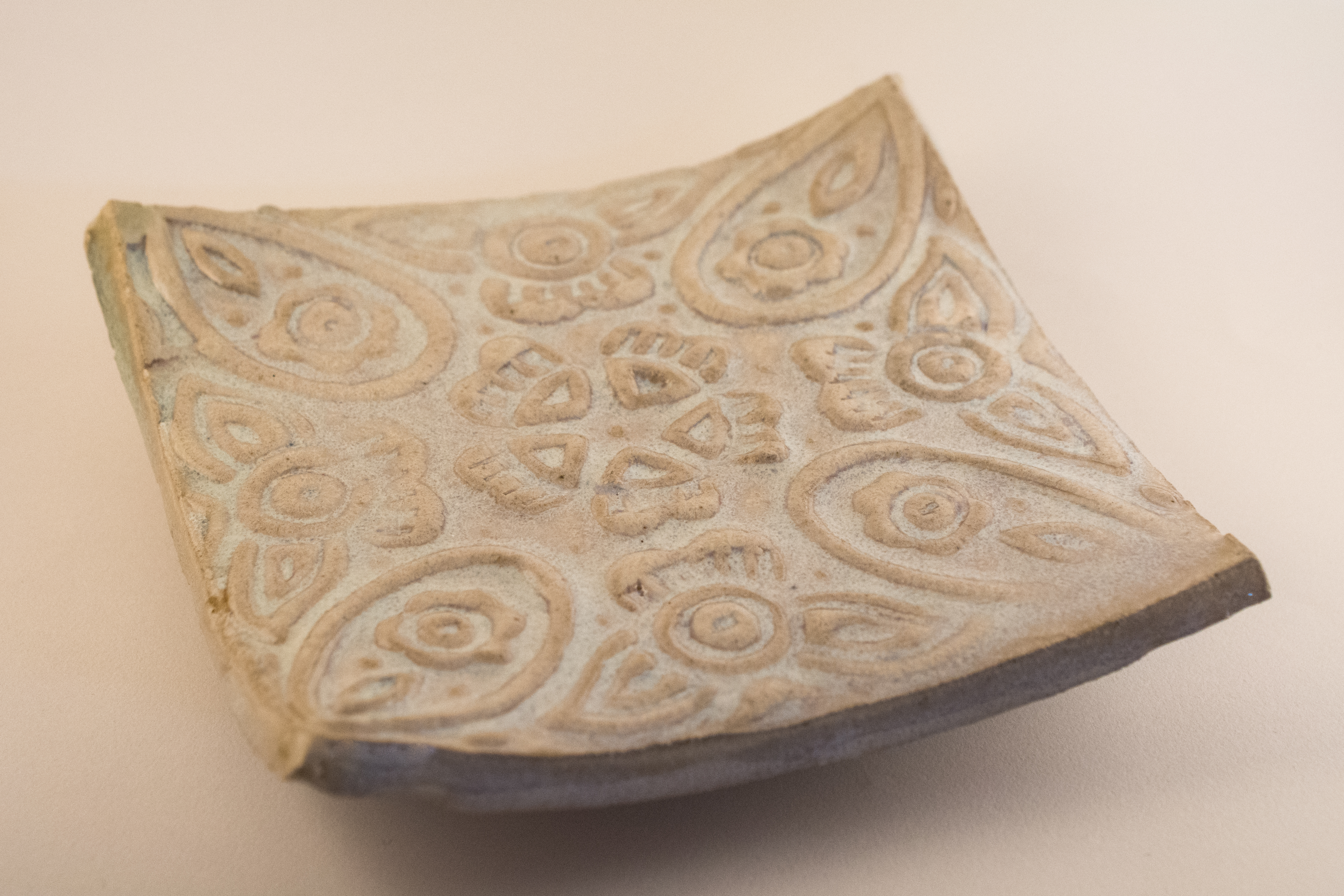 Textured Curved Plate (Cone 1, Rutile Glaze)