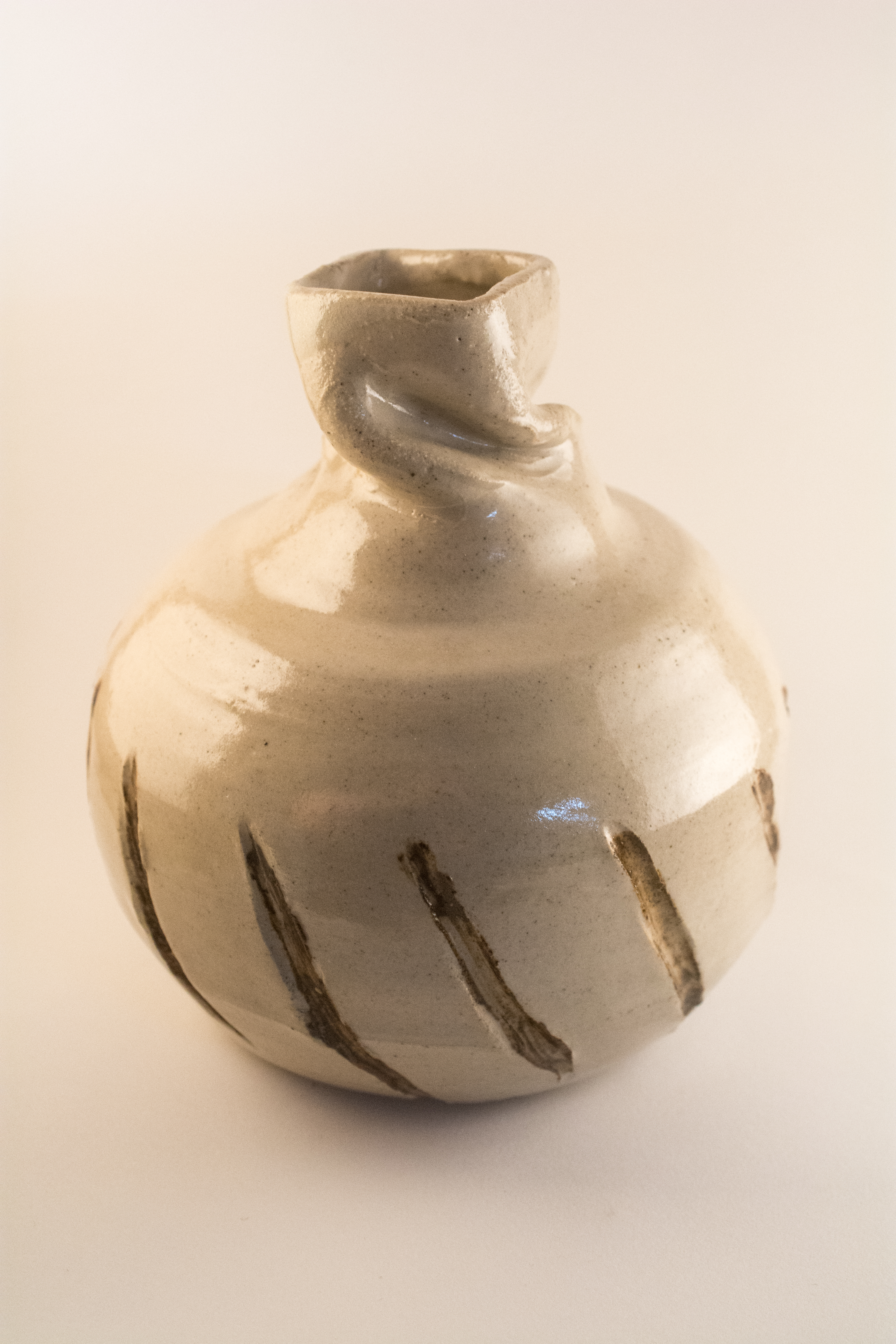 Altered Vase (Cone 10, unknown white and brown glazes)