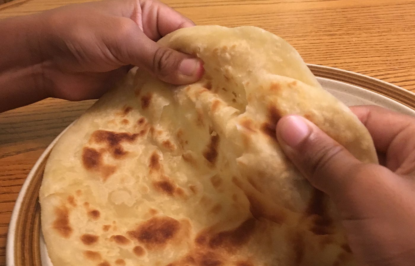 Whole tilapia, marinated, and roasted. Chapati transforms from Indian flatbread to Kenyan treat