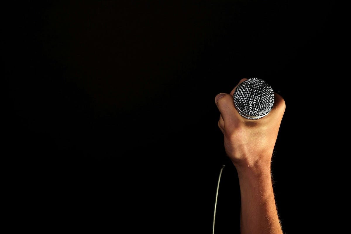 Someone holding the microphone confidently