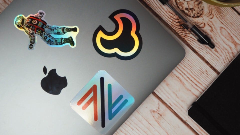 What’s the difference between holographic and glitter stickers?