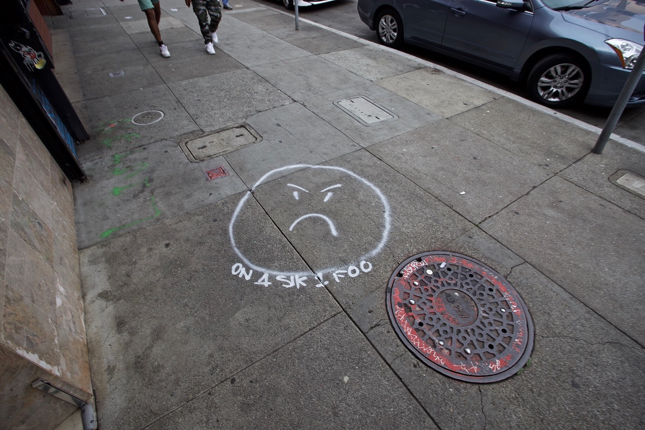 sidewalk frown street art