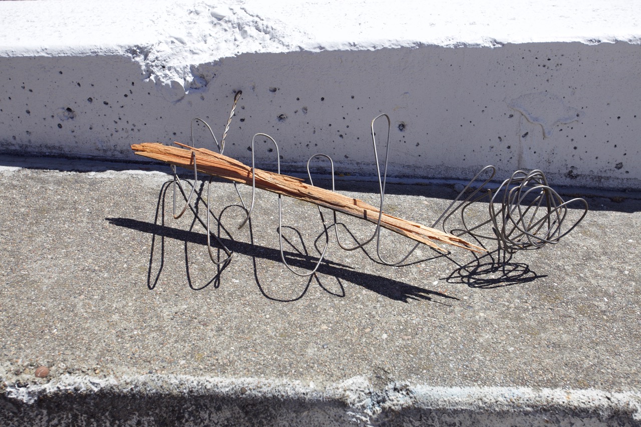 Wire around a piece of wood