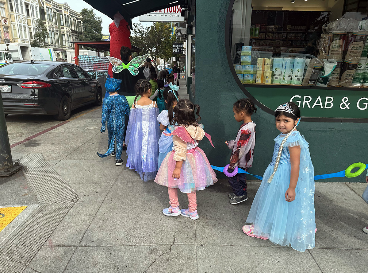 A line of young girls dressed as princesses