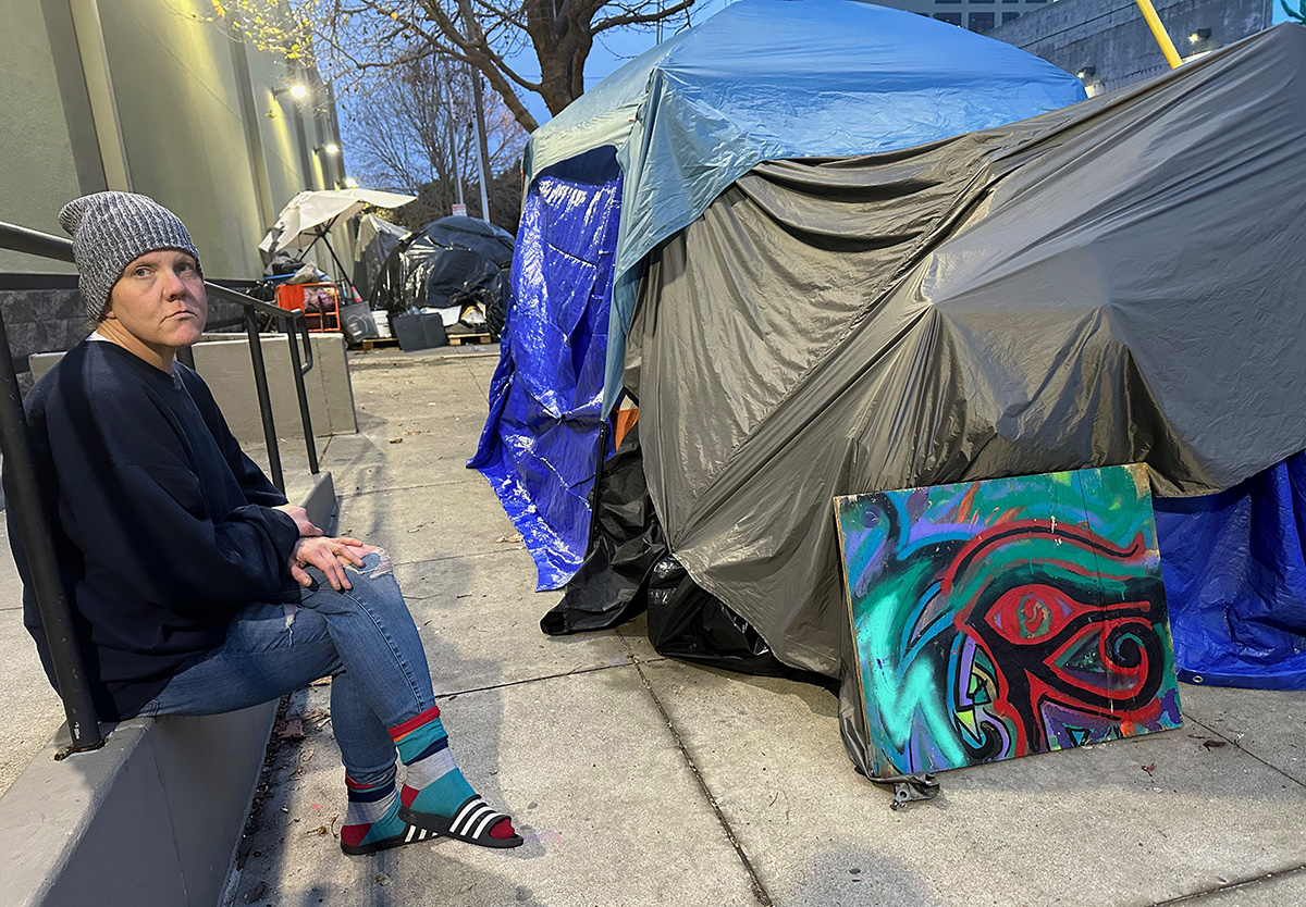Amanda, 41, near her and her wife's tent on Alameda, behind Best Buy.