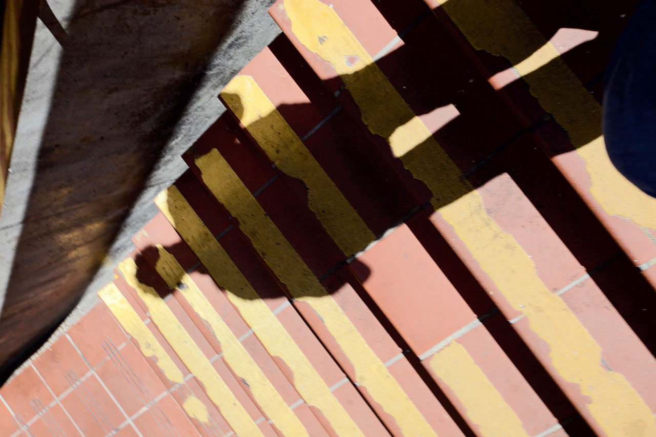 A man's shadow on the stairs.