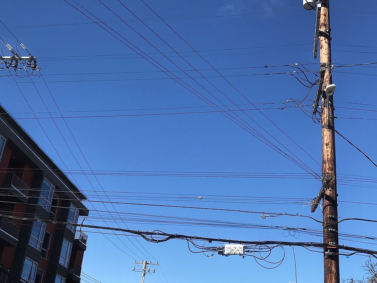 Electric poles and wires on a street.