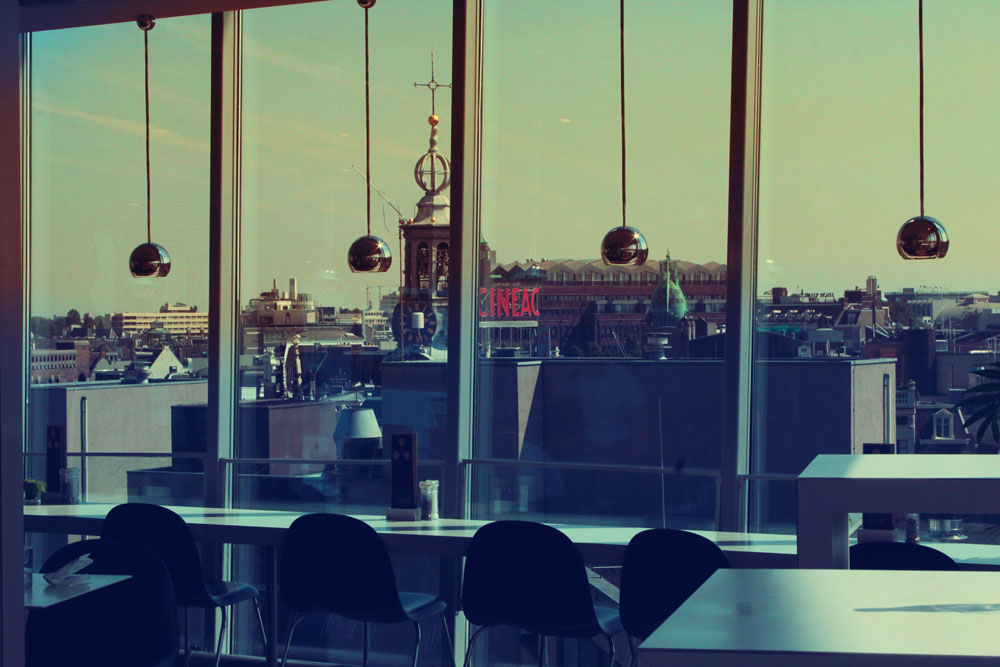 Some sort of rooftop cafe with glass walls that offered an amazing view