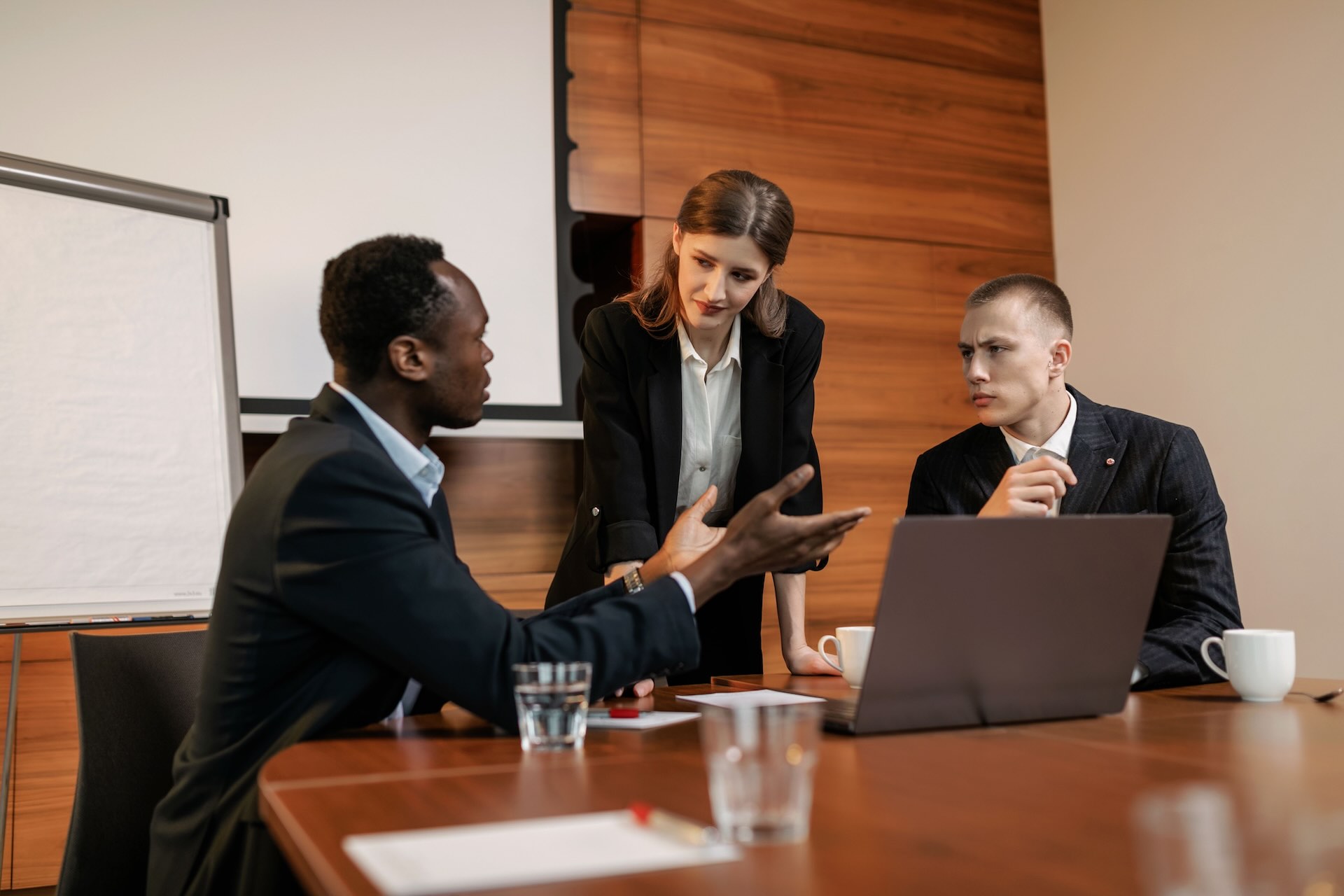 Three board members having a discussion | Featured Image for the Board of Directors Review Page of MJSP.
