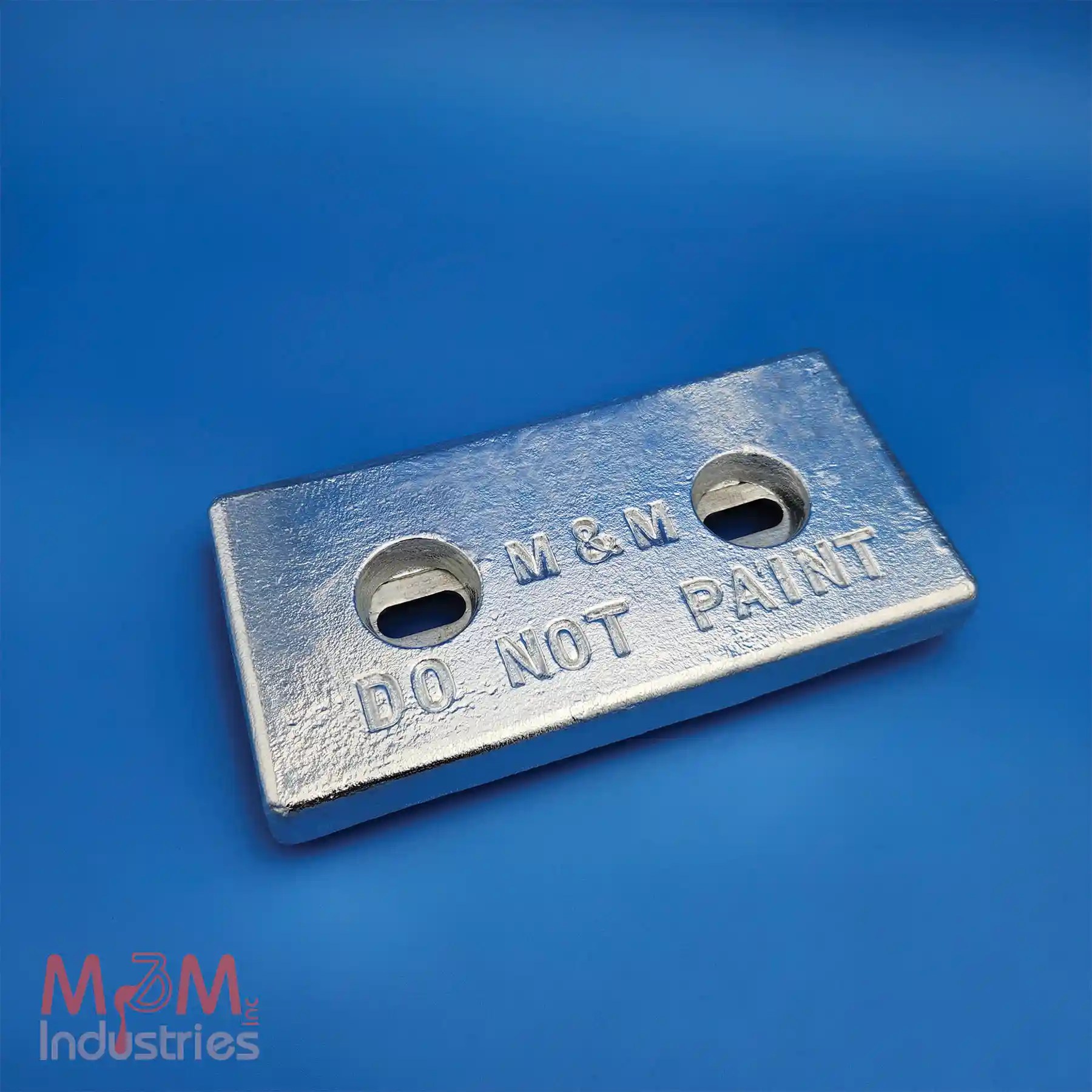 Manufactured in the USA by M&M Industries. ZHC-23 elongated holes zinc sacrificial anode measuring 6″ x 12″ x 1-¼″, manufactured from MIL-A-18001 zinc alloy