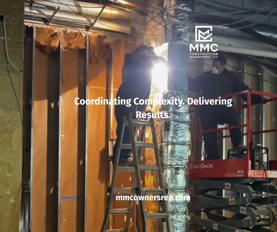 Construction crew working inside Salt + Stone restaurant during the commercial renovation coordinated by MMC Construction Management.