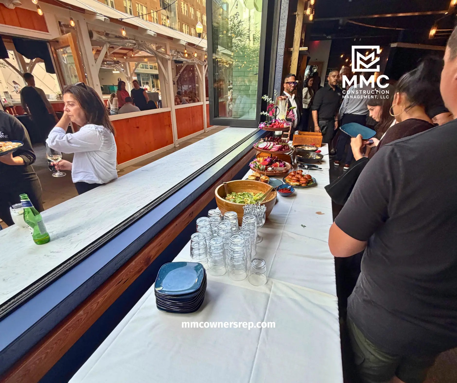 Guests celebrating the grand reopening of Salt + Stone restaurant at Assembly Row following the completed renovation coordinated by MMC Construction Management.